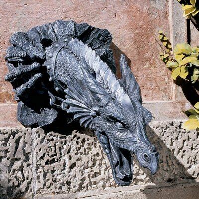 This adorable outdoor dragon statue is available in three poses, including two sleeping poses and one standing pose. Large Outdoor Dragon Statue | Wayfair
