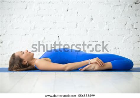 Young Attractive Woman Practicing Yoga Lying Stock Photo Edit Now