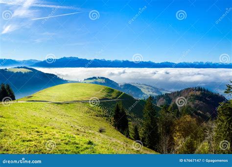 Panoramic Cloudscape Skyline View Of Swiss Alps In Blue Sky Stock