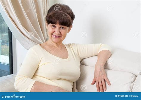 65 Years Old Good Looking Woman Portrait In Domestic Environment Stock Image Image Of