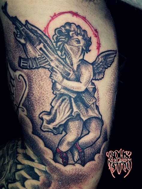 Share 73 Angel Holding Ak 47 Tattoo Ineteachers