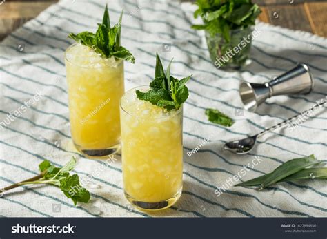 Homemade Boozy Green Chartreuese Swizzle Cocktail Stock Photo