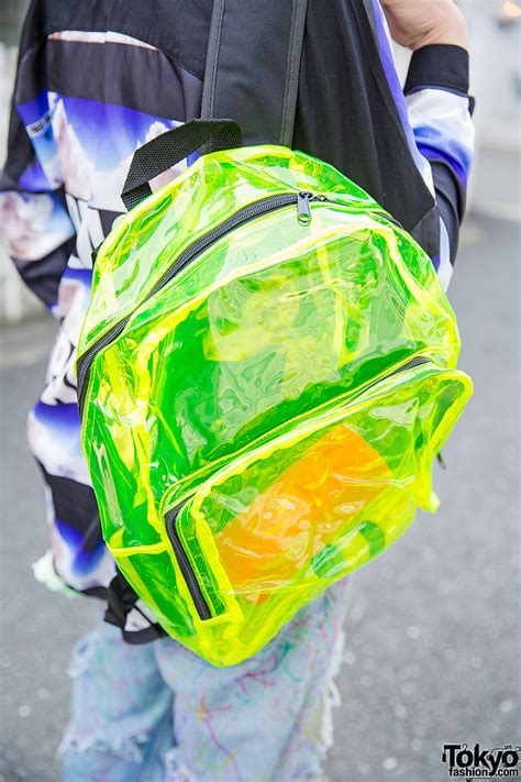 Safety Pins Hat Comic Tee And Torn Jeans And Neon Backpack In Harajuku
