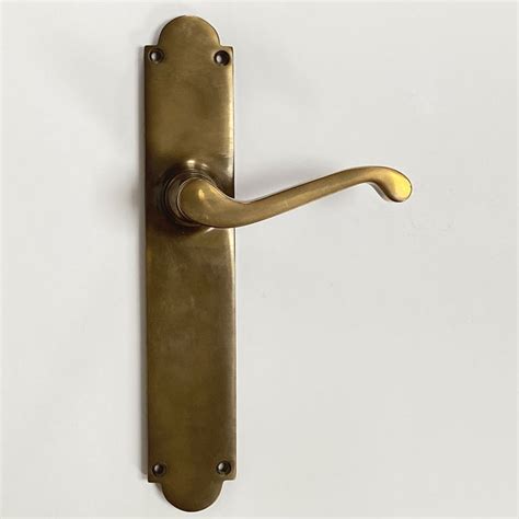 Aston Victorian Door Handles Long Plate Antique Brass Unlacquered