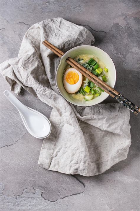 Once the spinach has wilted and the peas are warmed through, lightly beat and add in the eggs. Asian Soup With Eggs, Onion And Spinach Stock Image ...