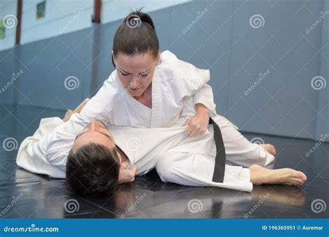 Woman On Floor With Opponent In Karate Hold Stock Image Image Of