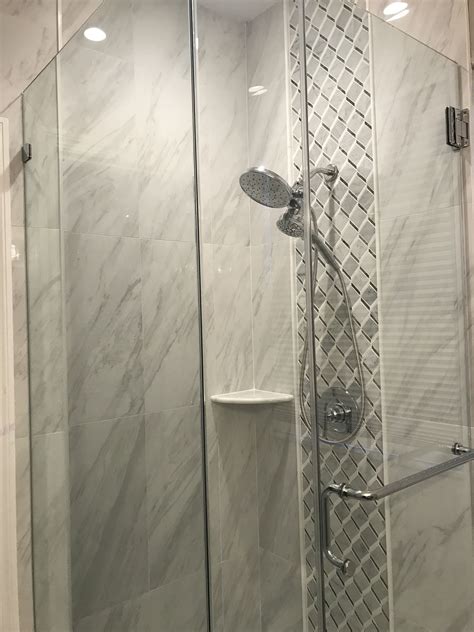 The shower space uses two different types of tile, the small format for the flooring, and the large format for the rest of the space. Gray marble, waterfall, stall shower 36x36, small bathroom ...