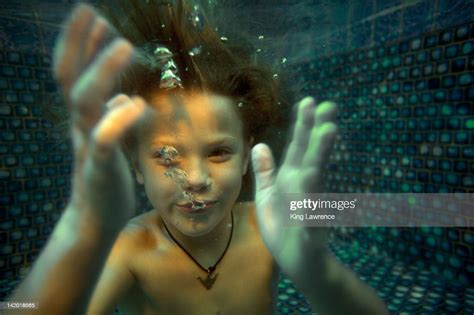 Boy Swimming Underwater In Swimming Pool High Res Stock Photo Getty