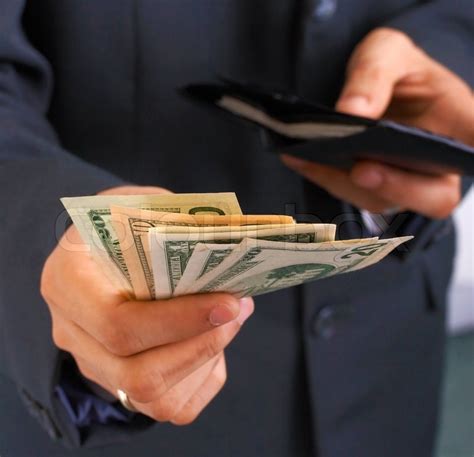 Most coin shop owners i've queried pay 85 to 95% of the spot price. Taking Money From Wallet And Paying Dollars | Stock Photo | Colourbox