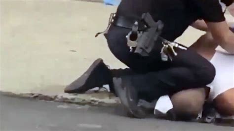 Investigation Launched After Allenton Cop Filmed Kneeling On Black Man