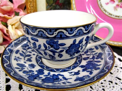 Old royal tea cup and saucer england fine bone china cabbage rose chintz pattern pink blue yellow paragon tea cup and saucer trio england black trim heavy floral pink yellow blue purple beautiful antique tea cup and saucer d & co. ROYAL DOULTON TEA CUP AND SAUCER BLUE & FLORAL BUTTERFLY ...