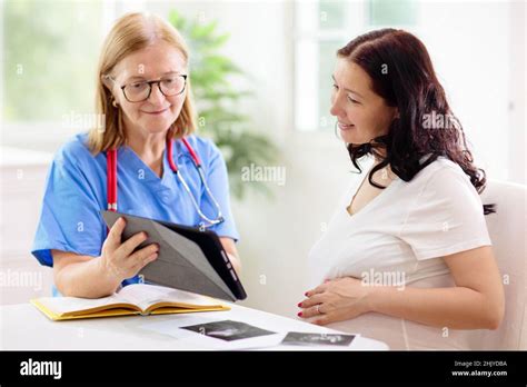 Doctor Examining Pregnant Woman Pregnancy Check Young Asian Female At