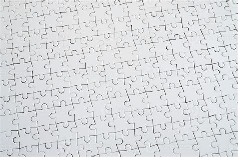 Close Up Texture Of A White Jigsaw Puzzle In Assembled Condition Top View Many Components Of A