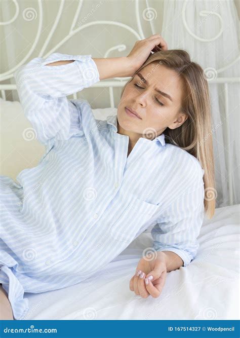 Attractive Young Woman In Bad With Migraine Headache Problems In