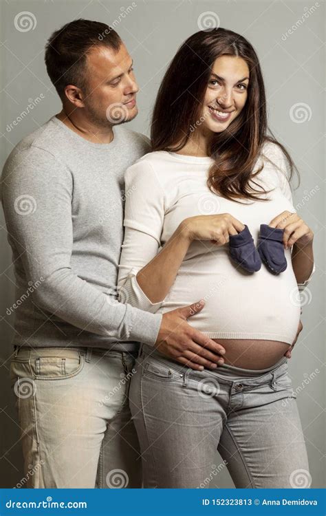Beautiful Pregnant Couple Hugging And Smiling Love And Tenderness The Happiness Of Waiting