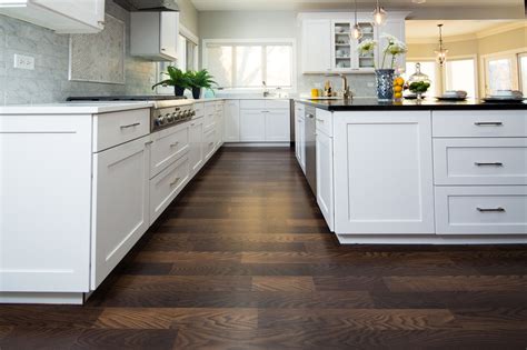 Laminate flooring in the kitchen is okay as long as you're diligent about cleaning up spills and splashes. New Laminate Flooring Collection | Empire Today | Laminate ...