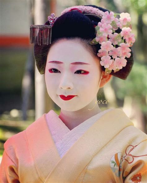 A Geisha With Flowers In Her Hair