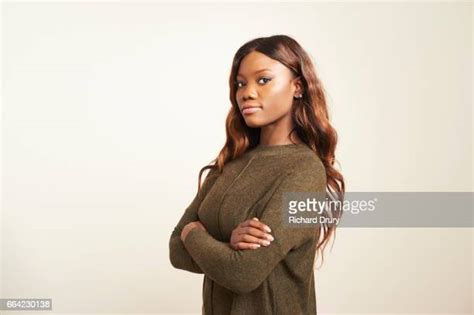 black woman folded arms photos and premium high res pictures getty images