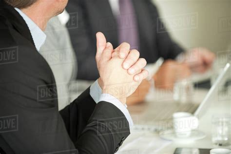 Businessman At Meeting Stock Photo Dissolve