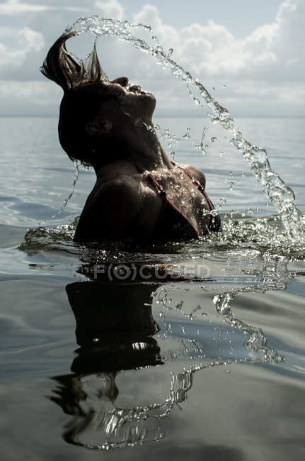 Girl Splashing With Hair — Fun Exotic Stock Photo 148696895