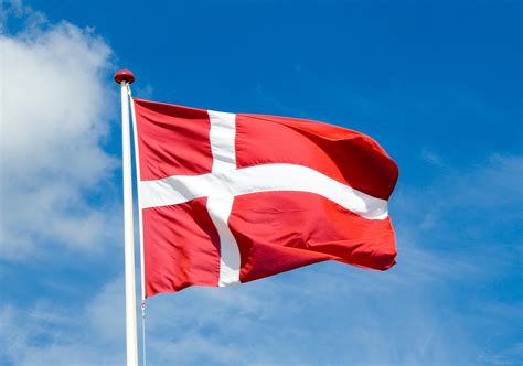The flag of denmark 1 is red with a white scandinavian cross that extends to the edges of the flag; National Flag Of Denmark - RankFlags.com - Collection of Flags