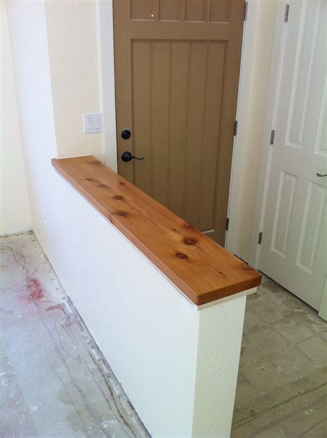 Pony Wall With Alaskan Cedar Cap Separates Entry From Living Room In