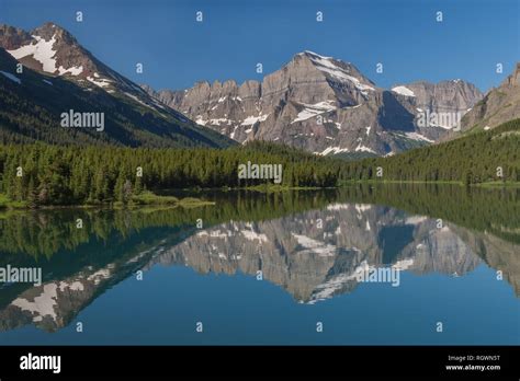 The Rugged Slopes And Glacier Of Angel Wing Are Beautifully Reflected