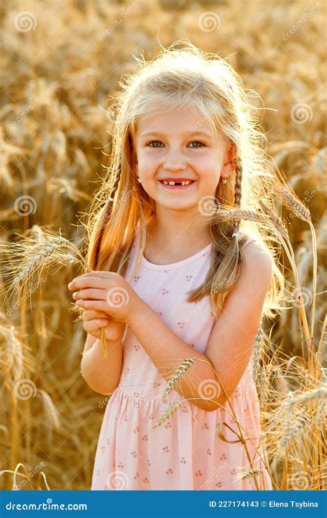 Portrait Of A Beautiful Little Girl Of 5 6 Years Old With Long Blonde