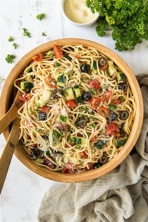 Made with tender pasta, pepperoni, fresh veggies and tossed in a zesty dressing then topped with parmesan cheese, this easy to make salad is ideal for soup and salad night! Summer Spaghetti Salad with Veggies and Italian Dressing