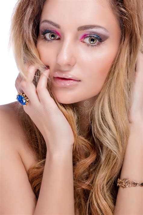 Beautiful Naked Blonde Girl With Bright Makeup And Long Curled Hair On