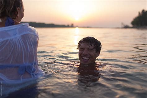 Couple Swimming With Clothes By Stocksy Contributor Mattia Stocksy