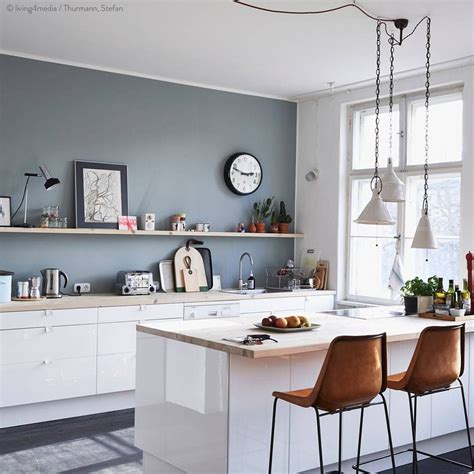 The color of these kitchen cabinets is lunar grey, and it works so well with brass hardware. Grey wall with white cabinets and warm brown chairs. Crisp ...