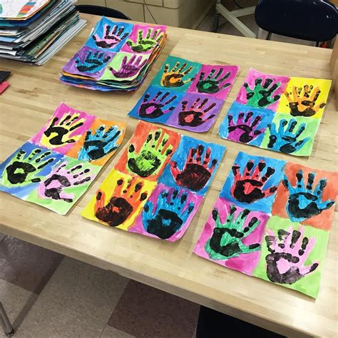 First Graders Finishing Up Their Andy Warhol Inspired Hand Artwork To