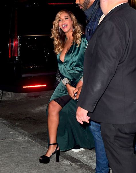 beyonce flashes her spanx as thigh high split causes wardrobe malfunction just three months