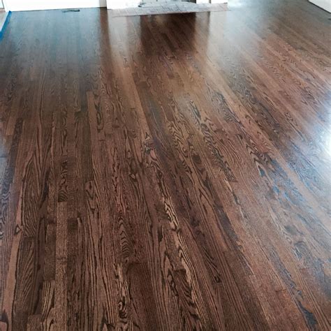 These floors have a more dull finish and don't require as much upkeep because they don't attain a high gloss. Refinished red oak with antique brown stain and finished ...