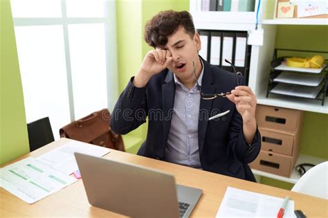 Non Binary Man Business Worker Tired Yawning At Office Stock Photo