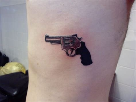 Gun Tattoo Designs What Are Gun Tattoo Designs And Why Are They Popular Body Tattoo Art