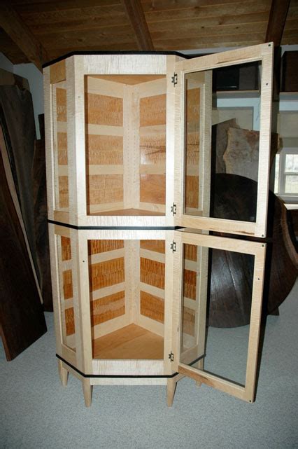 Our wooden and glass cabinets are designed to meet a broad range of customers. Custom Display Cabinet: By Dumond's Custom Furniture