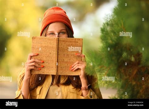 Beautiful Young Girl Reading Book In Park Stock Photo Alamy