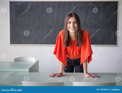 Female Teacher In Front Of A Classroom Stock Image Image Of Chalk