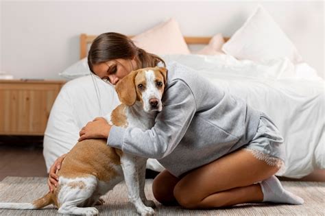 Free Photo Young Woman Hugging Her Dog