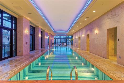 An Indoor Swimming Pool In A Large Building