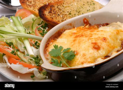 Food Italian Main Course Lasagne And Salad With Garlic Bread Stock