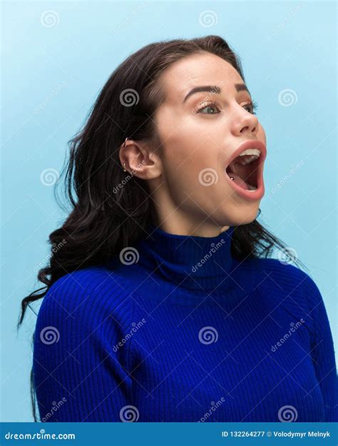 The Woman Screaming With Open Mouth Isolated On Blue Background