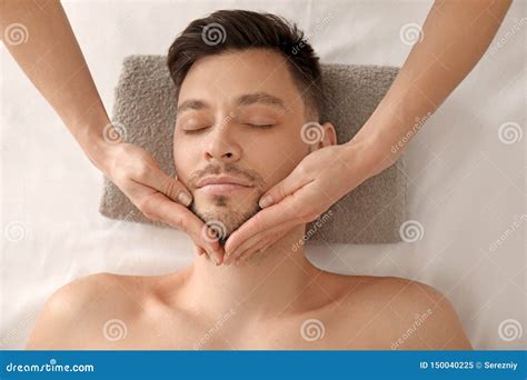 Handsome Man Having Facial Massage In Spa Salon Stock Image Image Of Cosmetology Relax 150040225