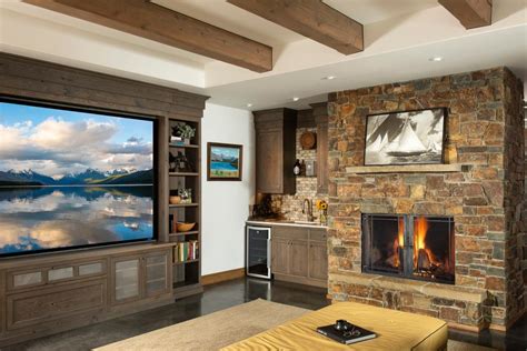 Modern Den Stays Cozy With Wood Beams Stone Fireplace Hgtv