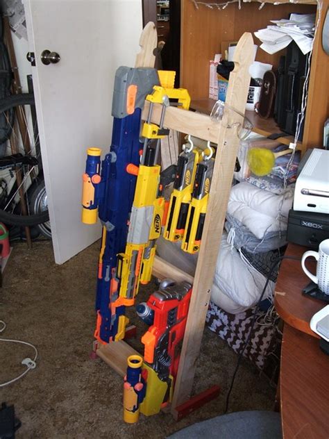 Nerf gun rack is painted in nerf colors. Nerf Gun Rack | The rack has storage for most types of ...