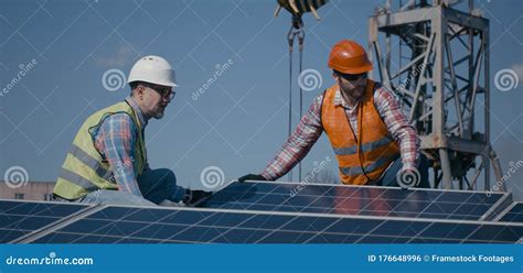 Technicians Installing Solar Panels in Sunshine Stock Photo - Image of