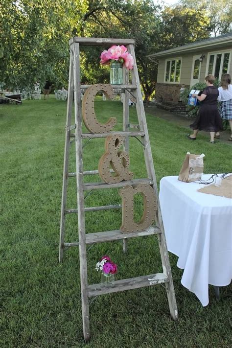 Guests leave a fingerprint to act as the eye of a feather, sign there name in the feather, or both. Enchanted forest wedding, farm wedding, logs, decorations ...