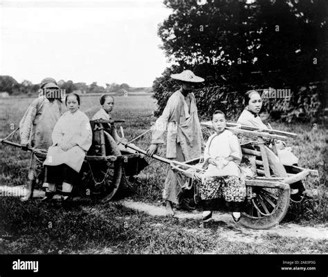 Women In Wheelbarrows Pushed By Men 1910 1925 Stock Photo Alamy